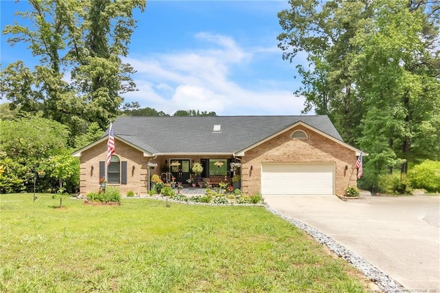 single story home with concrete driveway, covered porch, a front lawn, brick siding, and an attached garage