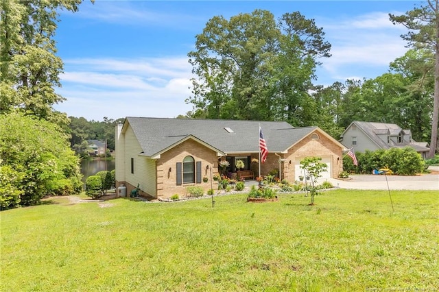 ranch-style house with driveway, a front yard, an attached garage, and brick siding