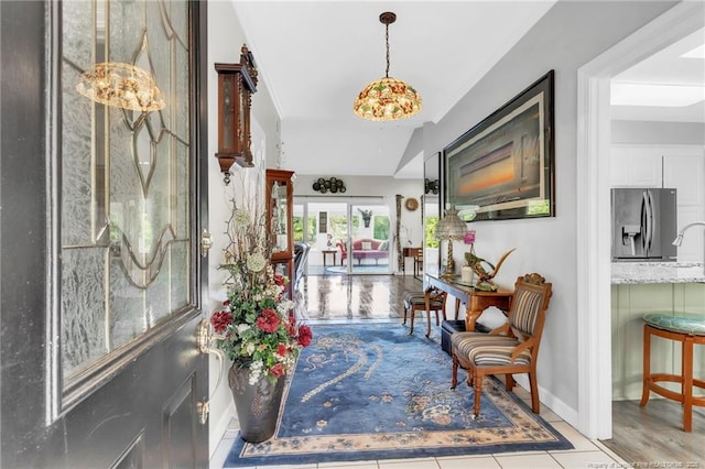 entryway featuring baseboards