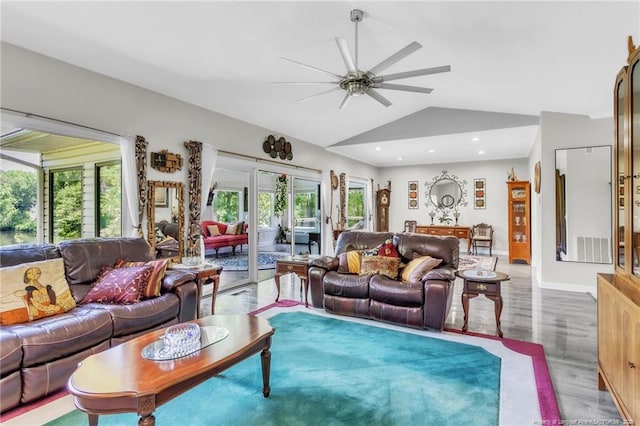 living area featuring lofted ceiling, a ceiling fan, wood finished floors, baseboards, and recessed lighting