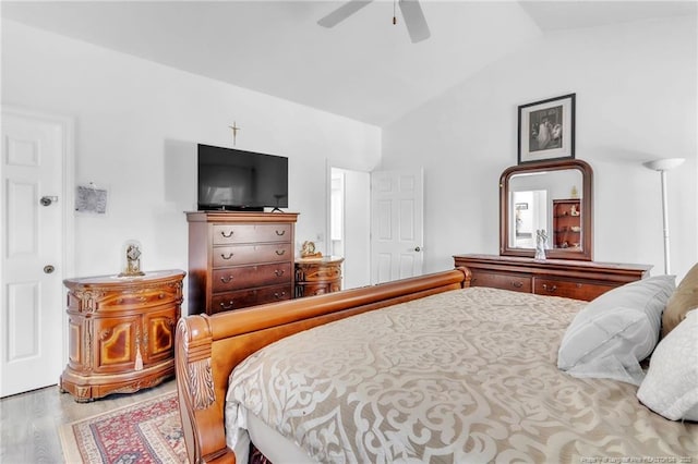 bedroom with lofted ceiling, wood finished floors, and ceiling fan