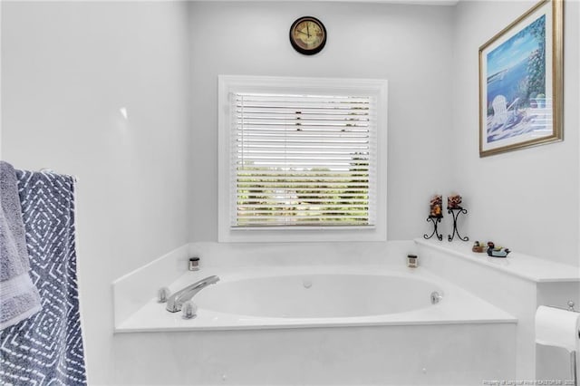 bathroom with a garden tub