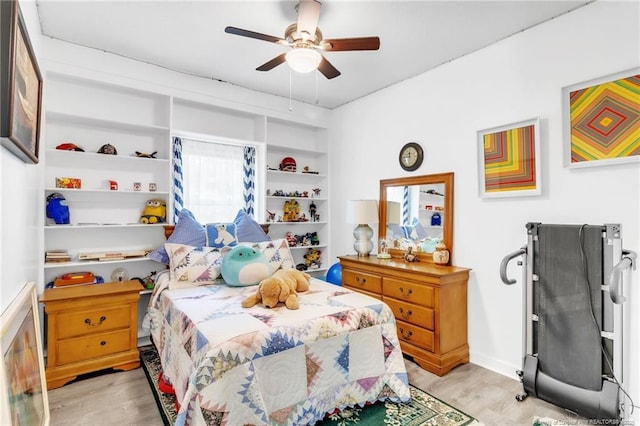 bedroom featuring light wood-style floors and ceiling fan