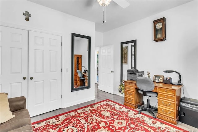 office with a ceiling fan and wood finished floors