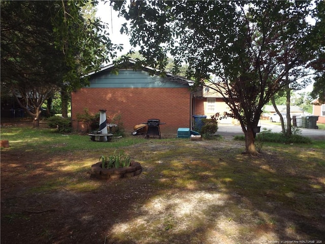 view of home's exterior featuring brick siding
