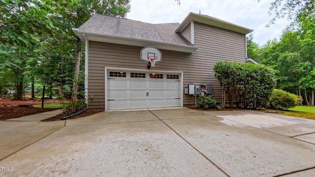 99 Grassy Creek Way, Chapel Hill, NC 27517 - view of home's exterior featuring driveway, an attached garage, and a shingled roof