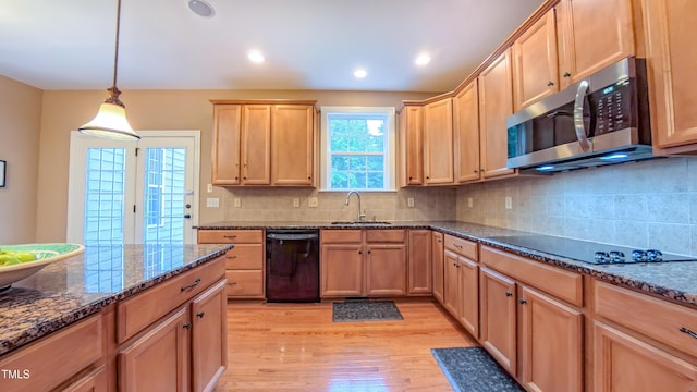 99 Grassy Creek Way, Chapel Hill, NC 27517 - kitchen featuring black appliances, a sink, light wood-style flooring, dark stone counters, and backsplash