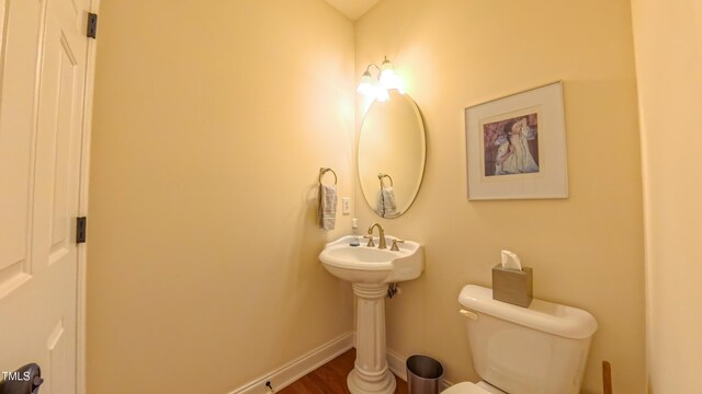 99 Grassy Creek Way, Chapel Hill, NC 27517 - bathroom with toilet, baseboards, and wood finished floors