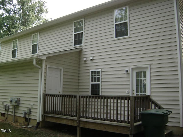 rear view of house featuring a deck