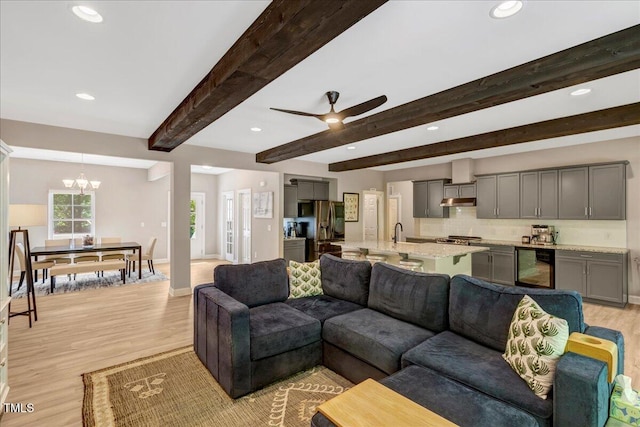 10304 Stallion Way, Bahama, NC 27503 - living area featuring beverage cooler, light wood-style floors, recessed lighting, ceiling fan, and beamed ceiling