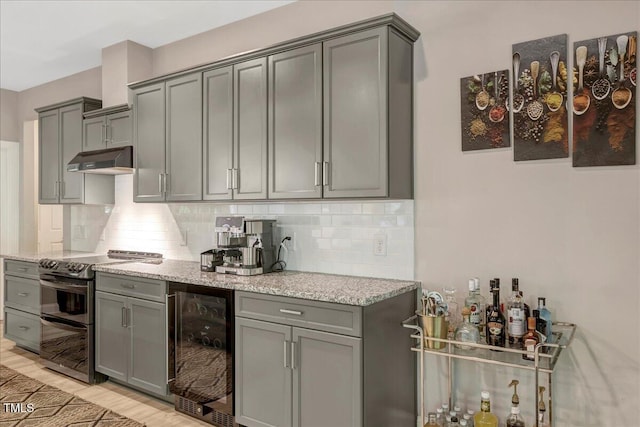 10304 Stallion Way, Bahama, NC 27503 - kitchen featuring wine cooler, double oven range, and gray cabinetry