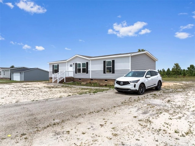 182 Ajax Dr, Saint Pauls, NC 28384 - manufactured / mobile home with crawl space and an outbuilding