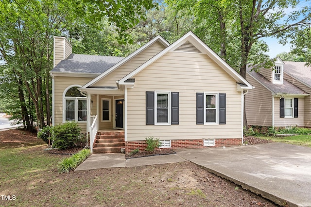 4401 Liverpool Ln, Raleigh, NC 27604 - view of front of home featuring a chimney, crawl space, and roof with shingles