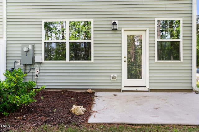 doorway to property featuring a patio area