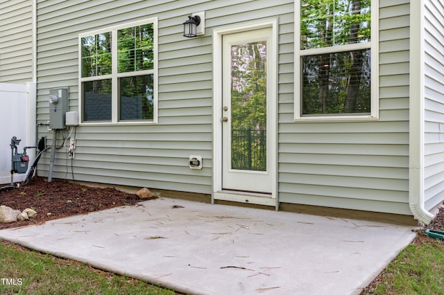 entrance to property with a patio