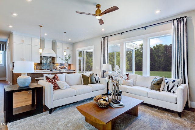 living room with recessed lighting and ceiling fan