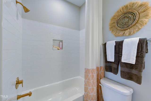 bathroom featuring shower / bathtub combination with curtain and toilet