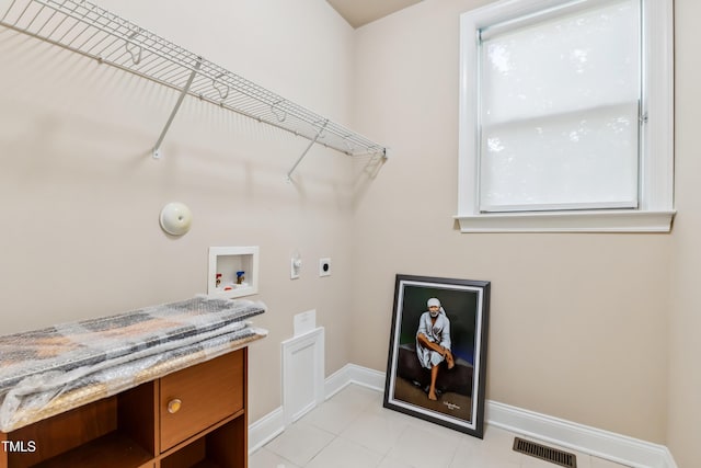 3404 Mount Pisgah Way, Cary, NC 27519 - washroom with hookup for an electric dryer, hookup for a washing machine, baseboards, hookup for a gas dryer, and light tile patterned flooring