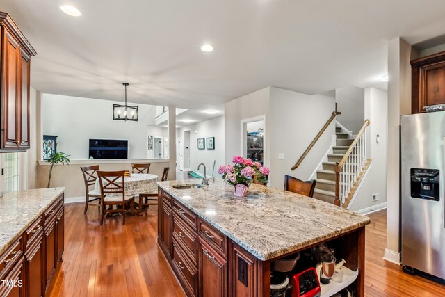 3404 Mount Pisgah Way, Cary, NC 27519 - kitchen with stainless steel refrigerator with ice dispenser, a sink, hardwood / wood-style floors, open shelves, and baseboards