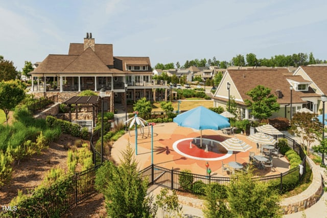 241 Serenity Hill Cir, Chapel Hill, NC 27516 - back of house with fence, a patio, and a chimney