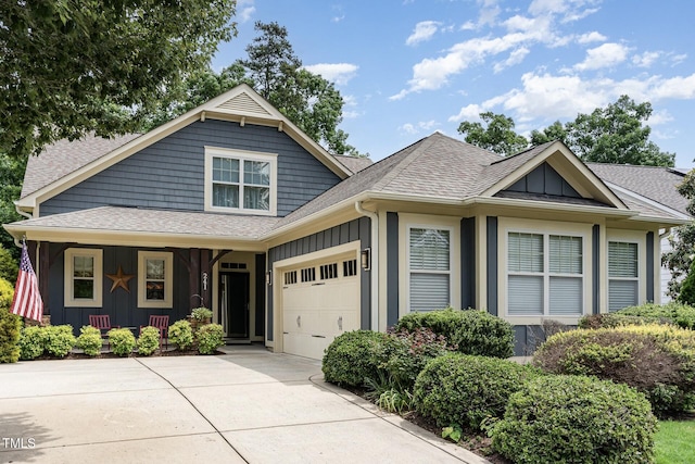 241 Serenity Hill Cir, Chapel Hill, NC 27516 - view of front of house featuring board and batten siding, an attached garage, concrete driveway, and roof with shingles