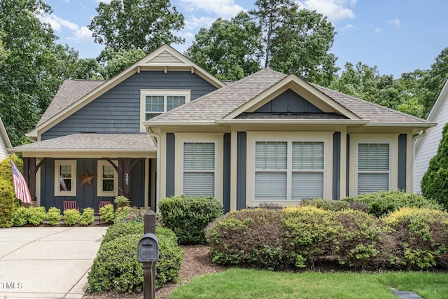 241 Serenity Hill Cir, Chapel Hill, NC 27516 - view of front of home featuring a shingled roof, covered porch, and board and batten siding