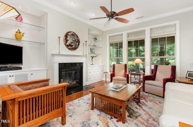 241 Serenity Hill Cir, Chapel Hill, NC 27516 - living room featuring plenty of natural light, a glass covered fireplace, crown molding, ceiling fan, and built in shelves