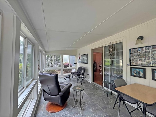 sunroom / solarium with a decorative wall