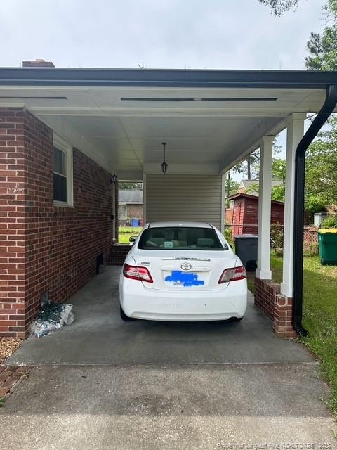 view of parking with an attached carport
