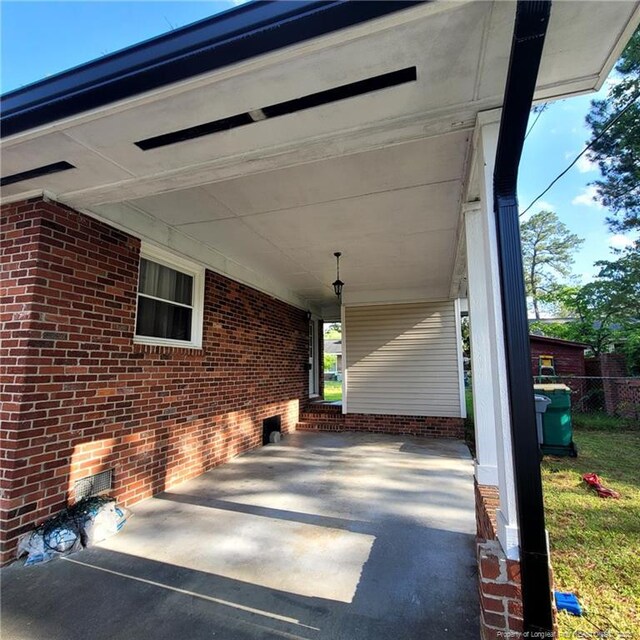 505 W 30th St, Lumberton, NC 28358 - porch featuring a carport