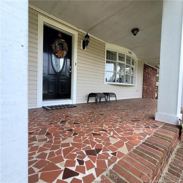 505 W 30th St, Lumberton, NC 28358 - view of exterior entry with a porch