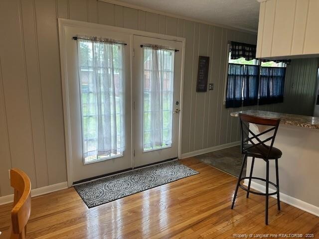 505 W 30th St, Lumberton, NC 28358 - entryway featuring baseboards, ornamental molding, wood finished floors, and a decorative wall