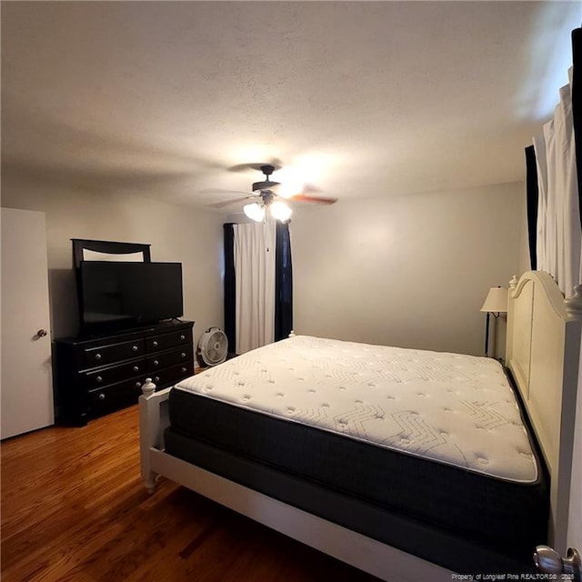 505 W 30th St, Lumberton, NC 28358 - bedroom with wood finished floors and ceiling fan