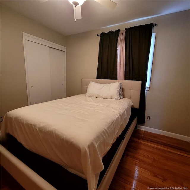 505 W 30th St, Lumberton, NC 28358 - bedroom featuring baseboards, wood finished floors, a closet, and a ceiling fan