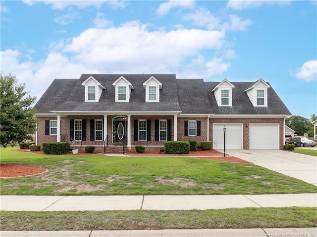 2815 Prioress Dr, Fayetteville, NC 28306 - cape cod-style house featuring brick siding, driveway, a front lawn, a porch, and roof with shingles
