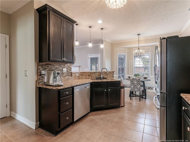 2815 Prioress Dr, Fayetteville, NC 28306 - kitchen with appliances with stainless steel finishes, a chandelier, a sink, crown molding, and light tile patterned floors
