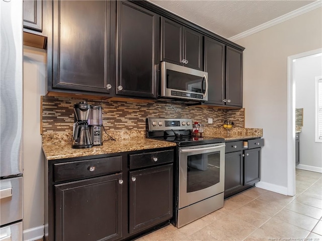 2815 Prioress Dr, Fayetteville, NC 28306 - kitchen featuring appliances with stainless steel finishes, crown molding, backsplash, baseboards, and light stone counters