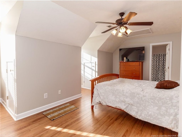 2815 Prioress Dr, Fayetteville, NC 28306 - bedroom with wood finished floors, baseboards, vaulted ceiling, and a ceiling fan