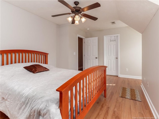 2815 Prioress Dr, Fayetteville, NC 28306 - bedroom featuring wood finished floors, baseboards, ceiling fan, and vaulted ceiling