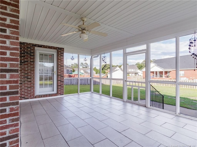 2815 Prioress Dr, Fayetteville, NC 28306 - unfurnished sunroom featuring a ceiling fan, healthy amount of natural light, and a residential view