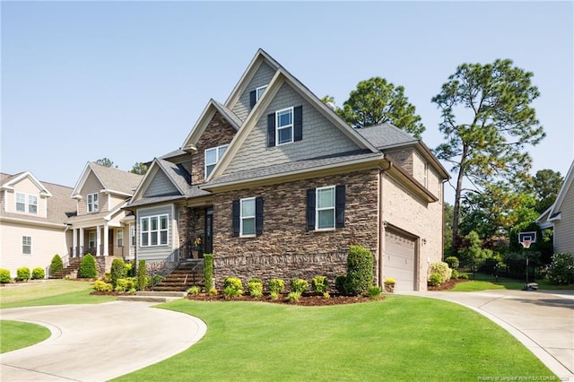 craftsman-style home with stone siding, driveway, an attached garage, and a front yard