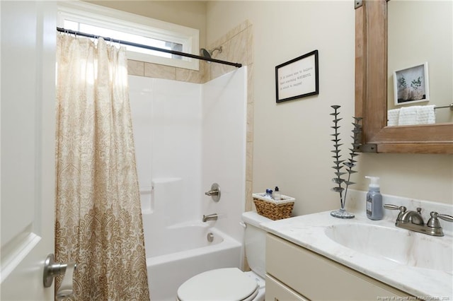 bathroom featuring vanity, toilet, and shower / bath combo