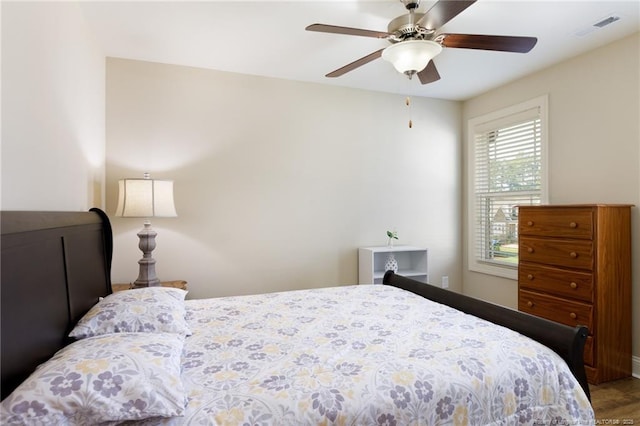 bedroom with wood finished floors and ceiling fan