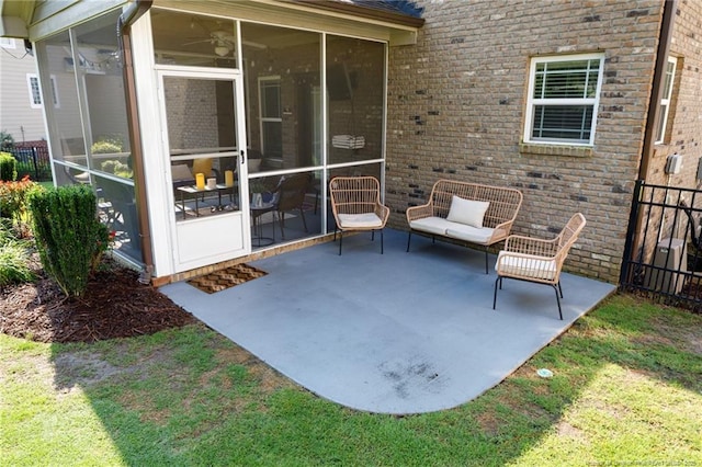 view of patio with a sunroom