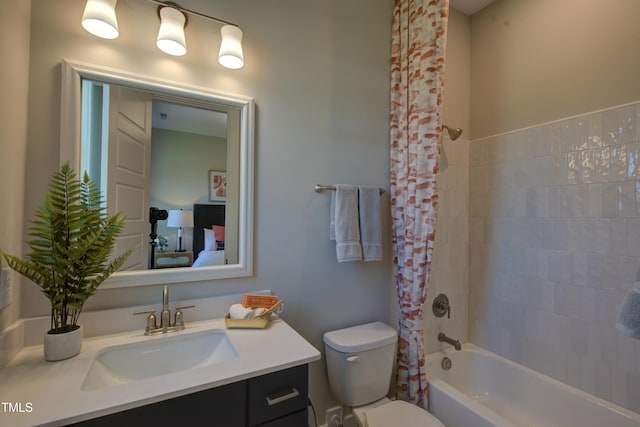 bathroom with vanity, toilet, and shower / tub combo