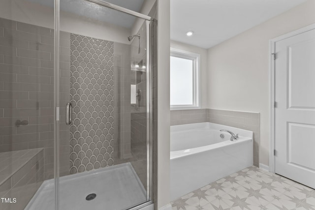 35 Windflower Ct Unit 9, Clayton, NC 27520 - full bathroom featuring tile patterned floors, a bath, and a stall shower