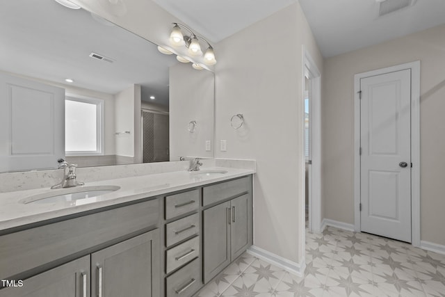 35 Windflower Ct Unit 9, Clayton, NC 27520 - bathroom with double vanity, tile patterned floors, and a shower