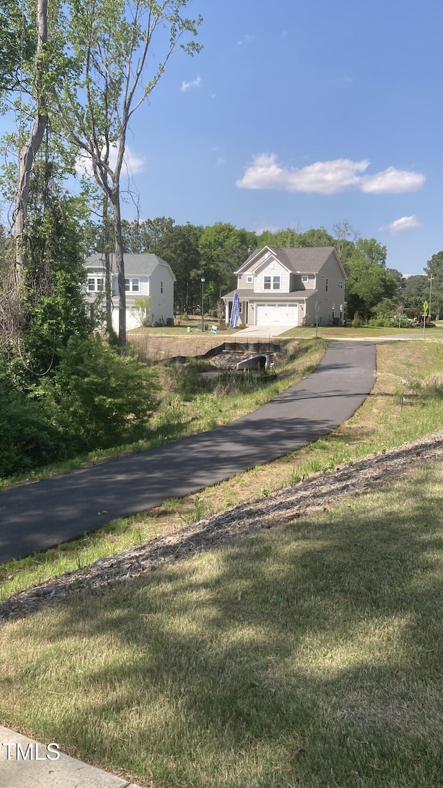 35 Windflower Ct Unit 9, Clayton, NC 27520 - view of front of property with a front yard and asphalt driveway