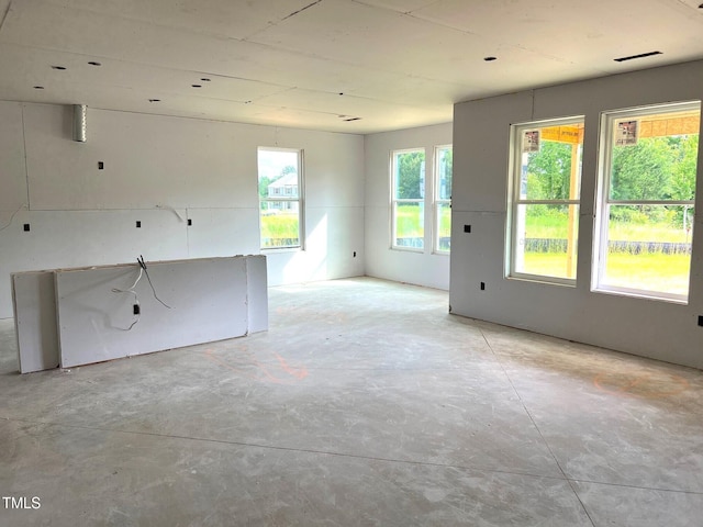 35 Windflower Ct Unit 9, Clayton, NC 27520 - unfurnished living room with unfinished concrete flooring