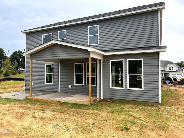 35 Windflower Ct Unit 9, Clayton, NC 27520 - rear view of house with a patio and a yard